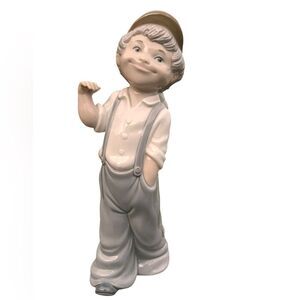 Lladro Zaphiv Signed Ceramic Boy Figurine Carrying A Hobo Bag And A Stick